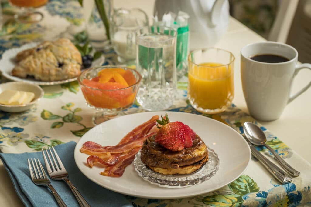 Bananas Foster French toast, fruit, scones, coffee and juice