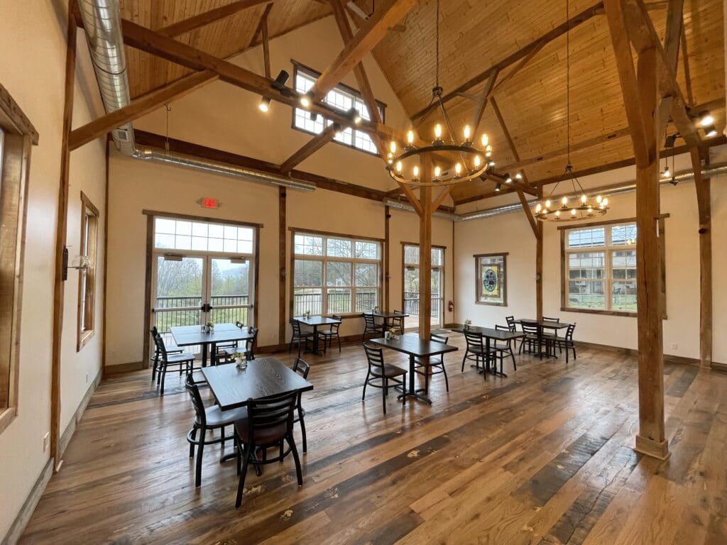 barn space looking outside with chandelier overhead