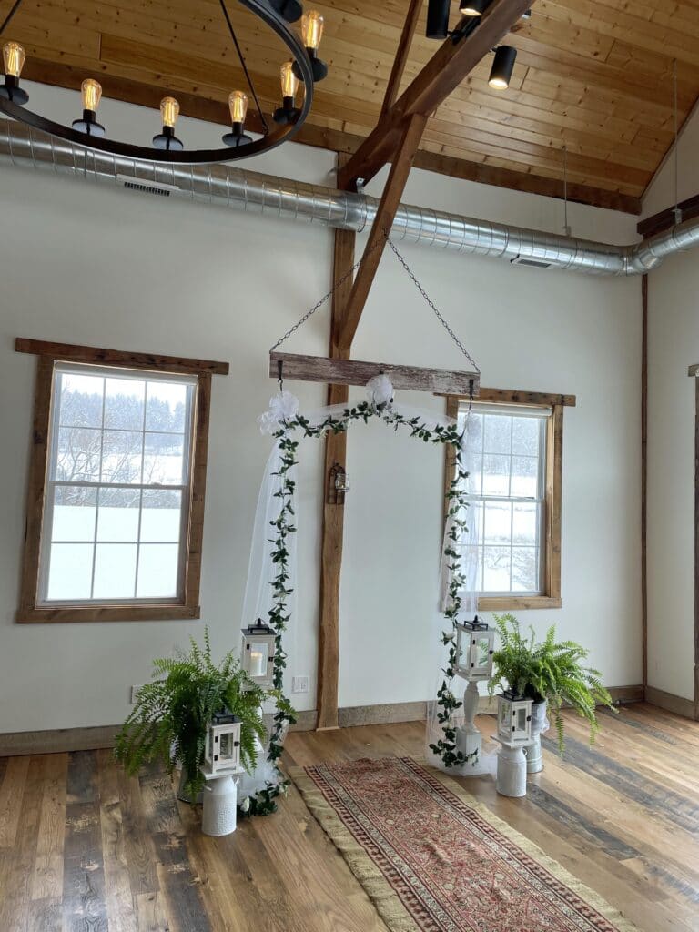 wedding arch set up in barn