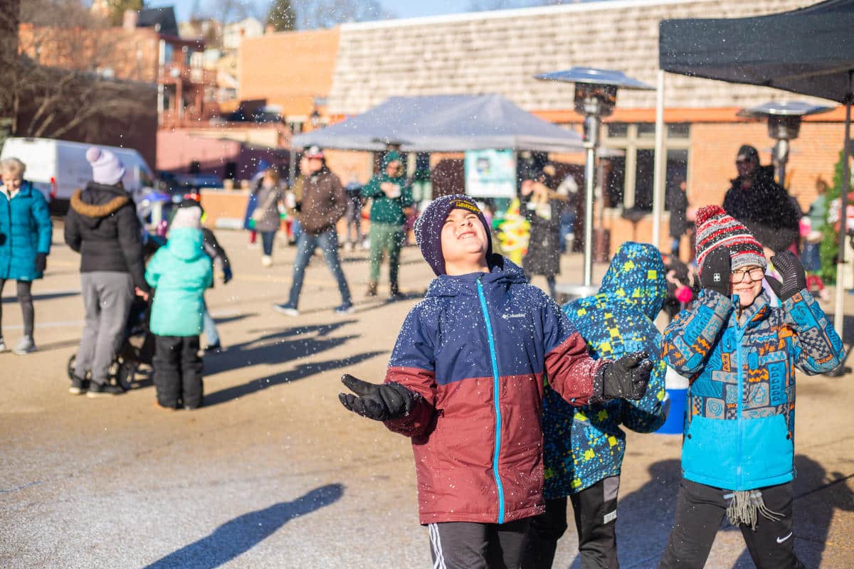 kids enjoying the snow at the Holidaze festival.